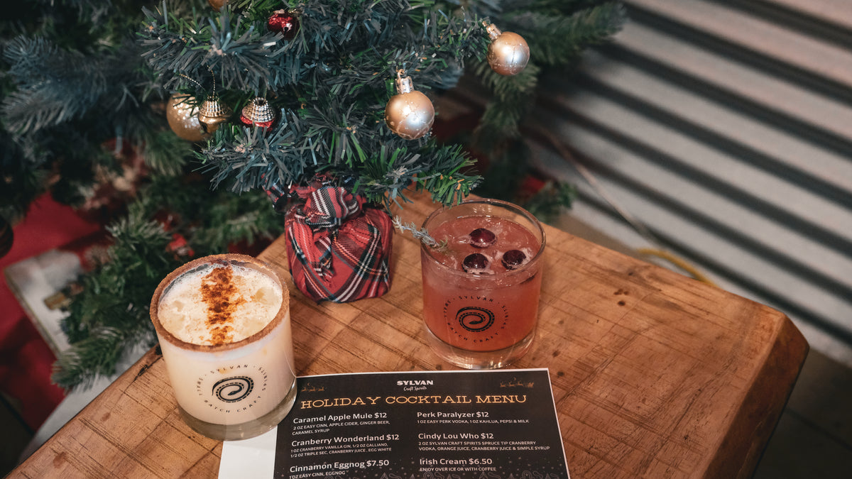 Christmas cocktails beside a decorated tree at Snake Lake Brewing