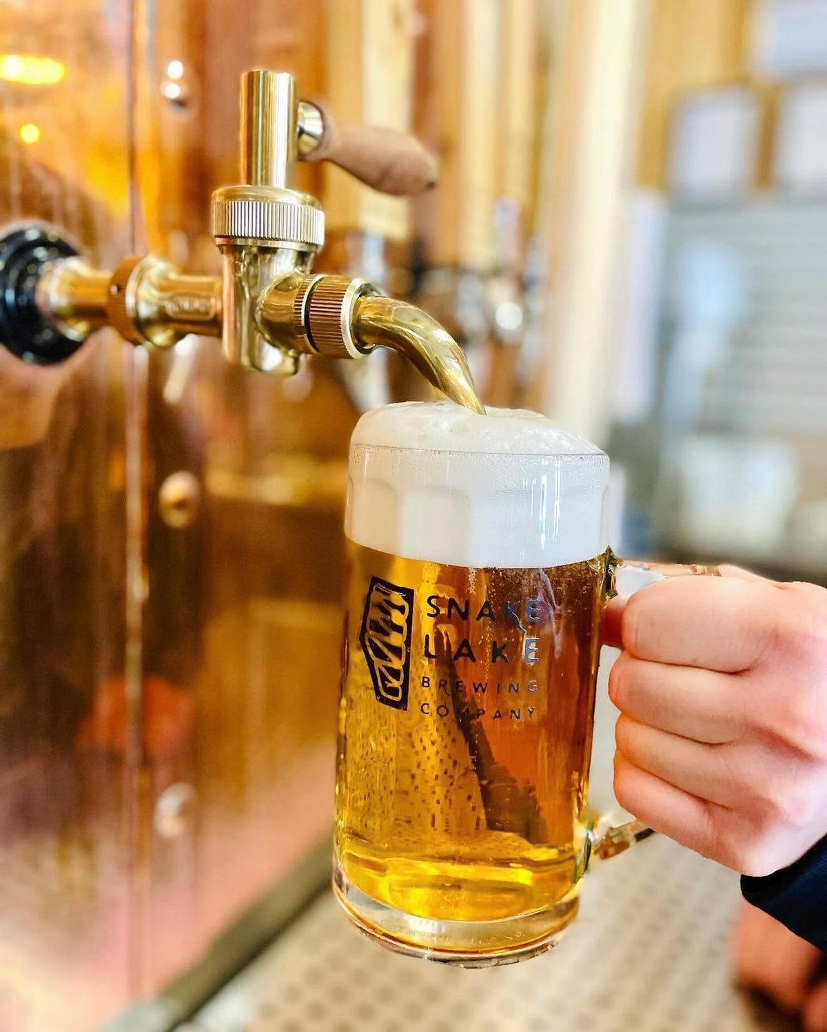 A Snake Lake beer being poured at the taproom